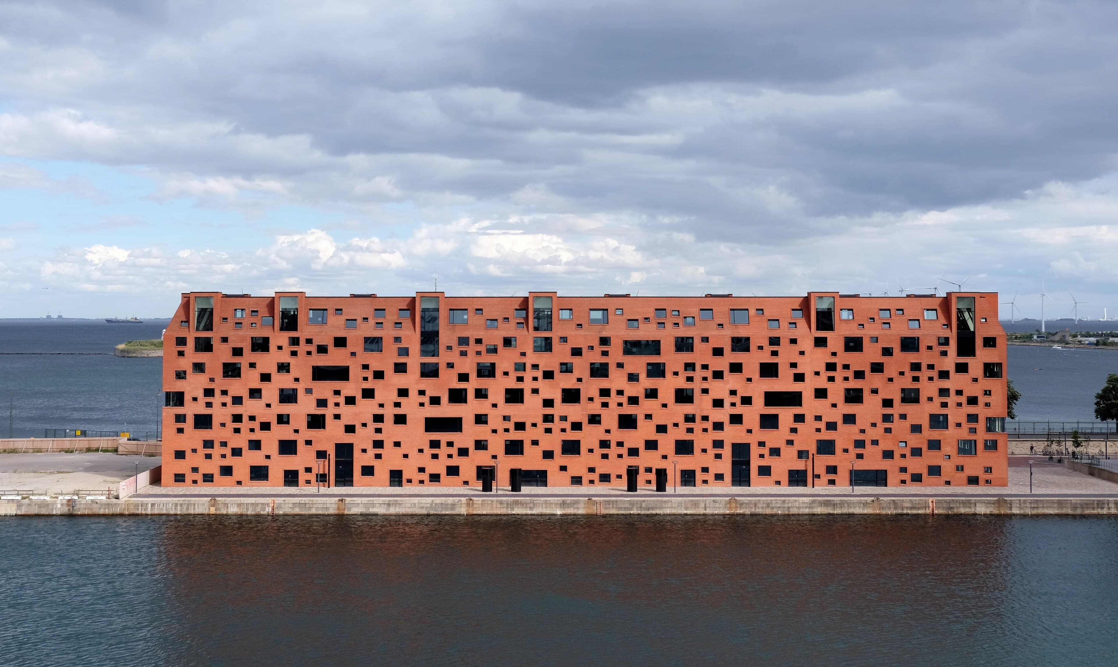 Commercial rooftop solar array near a port warehouse complex